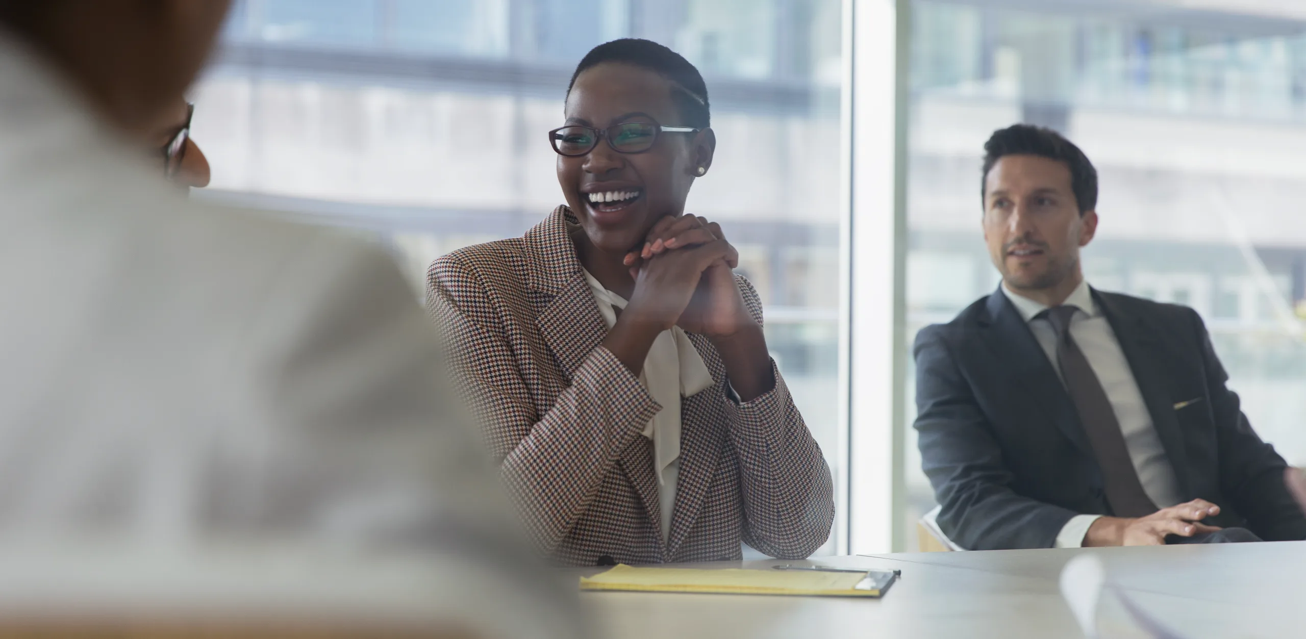 Laughing businesswoman in a conference room meeting