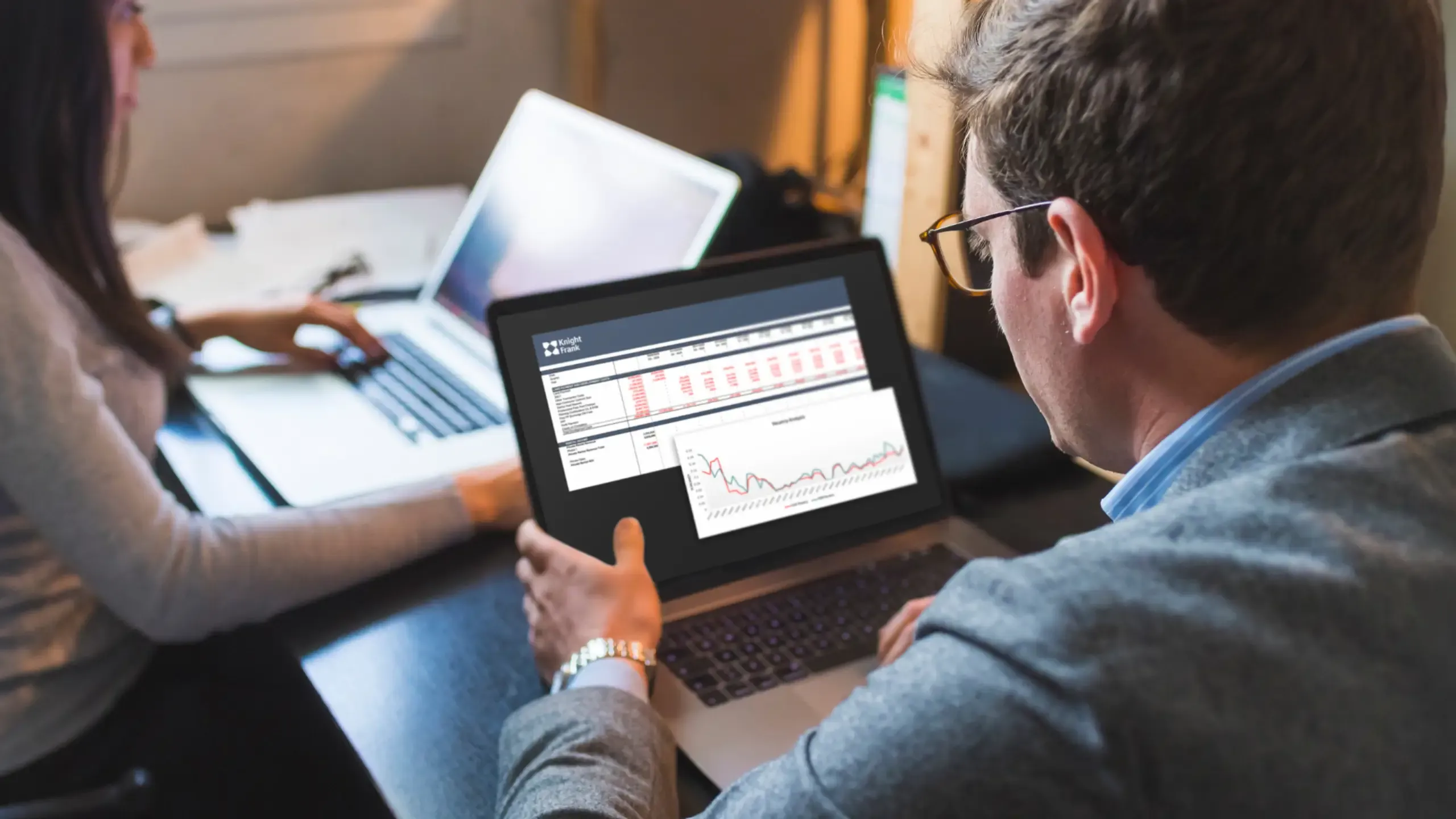 A business person on a laptop, working on financial modelling